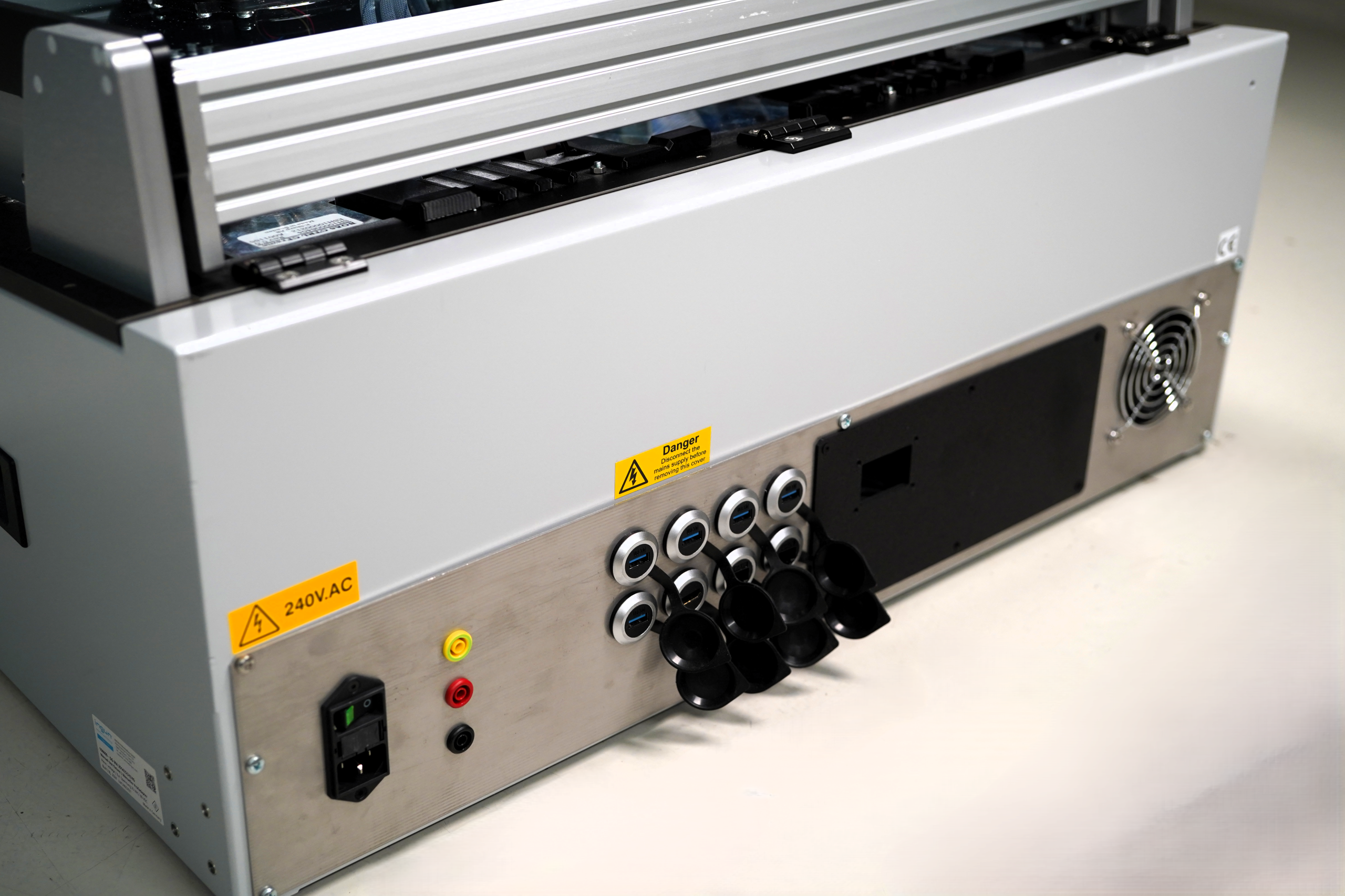 Rear of a Harmonix fixture with test connectors, mains inlet and cooling fan